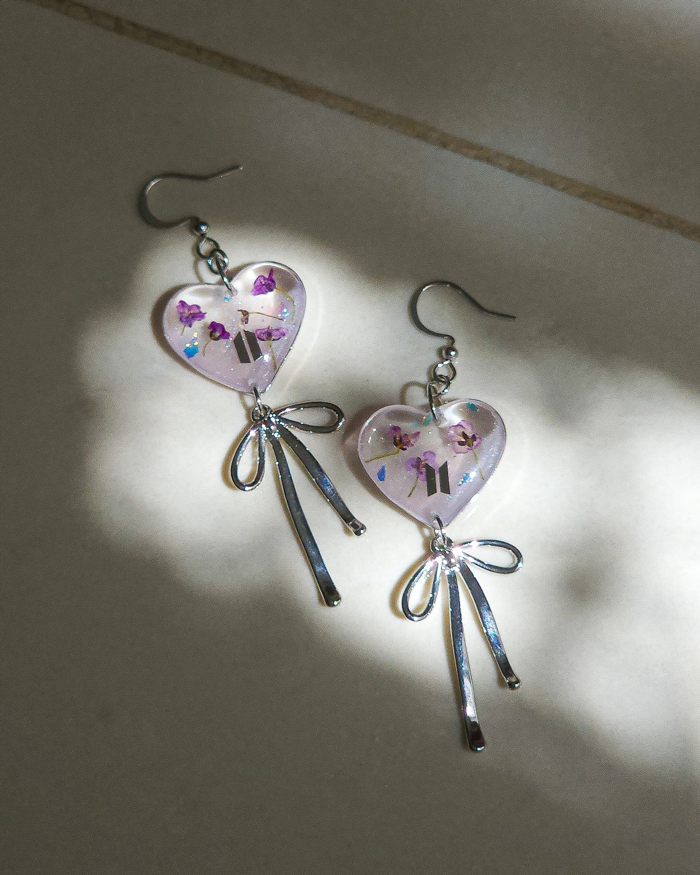 Heart-shaped earrings with bow inspired by BTS ๐ธ silver color