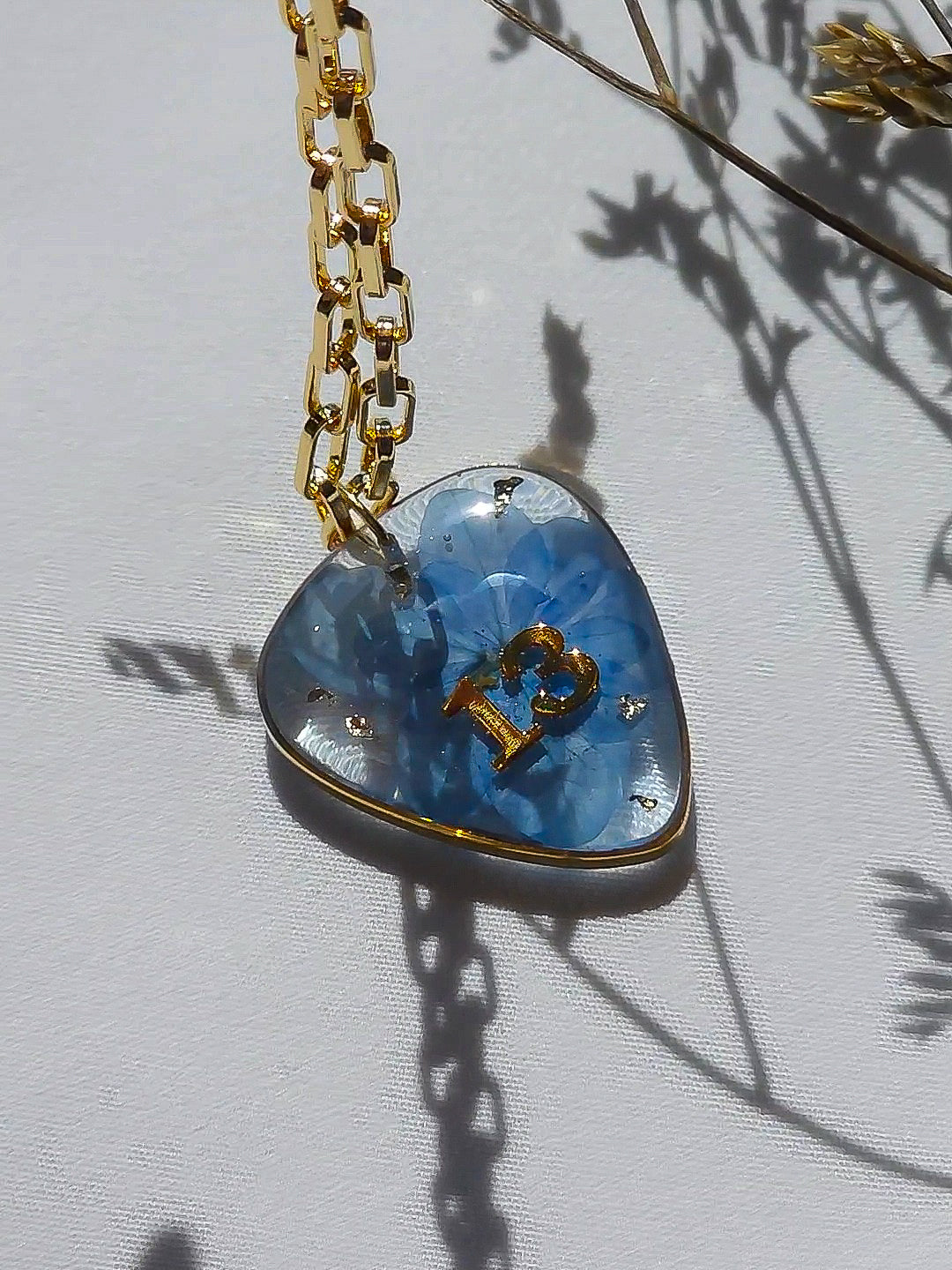 MUSE inspired guitarpick necklace with real flower